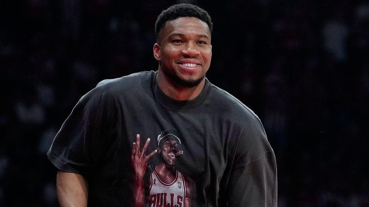 Giannis Antetokounmpo walking courtside at a EuroLeague playoffs basketball game