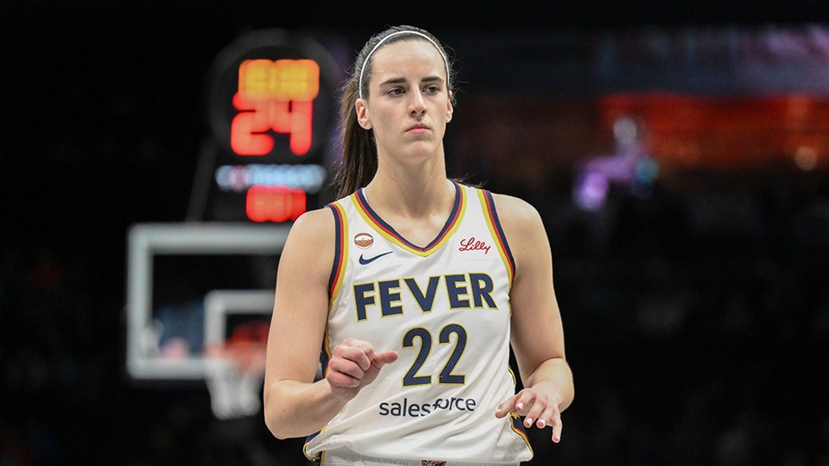Indiana Fever guard Caitlin Clark dribbling basketball during game at Barclays Center