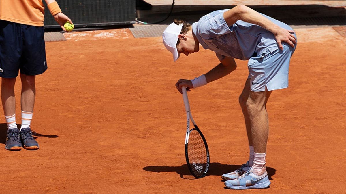 Jannik Sinner of Italy in pain