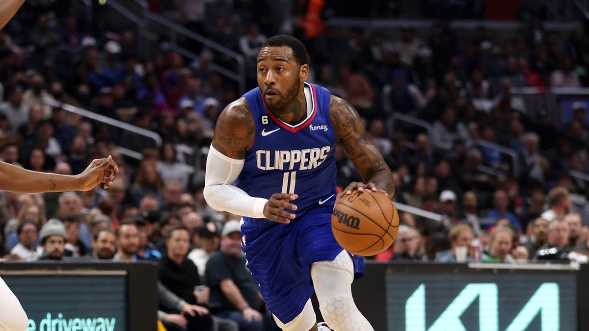 Los Angeles Clippers guard John Wall drives to the basket