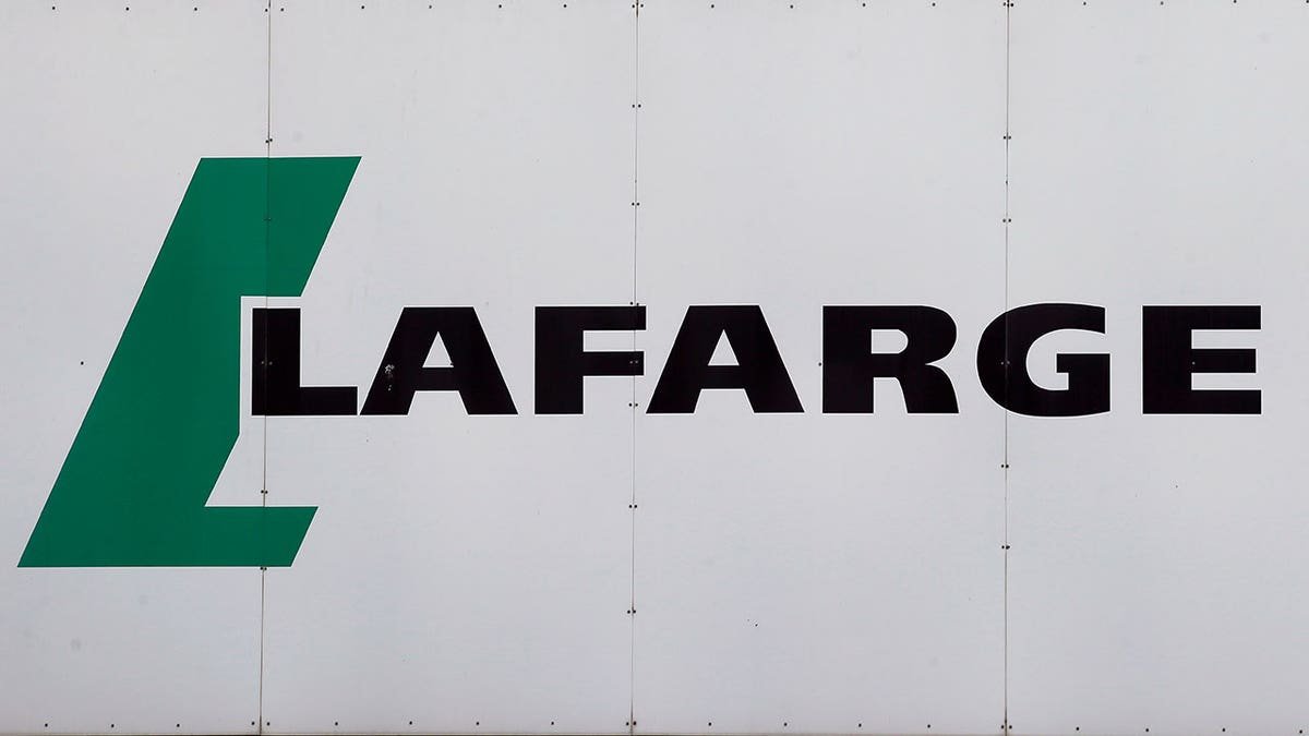 Lafarge logo displayed outside a white facility building