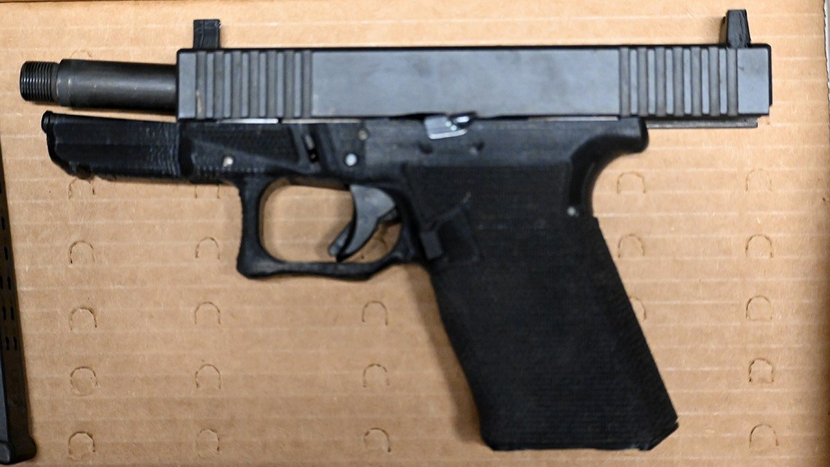 Luigi Mangione's gun displayed as evidence in a suppression hearing.