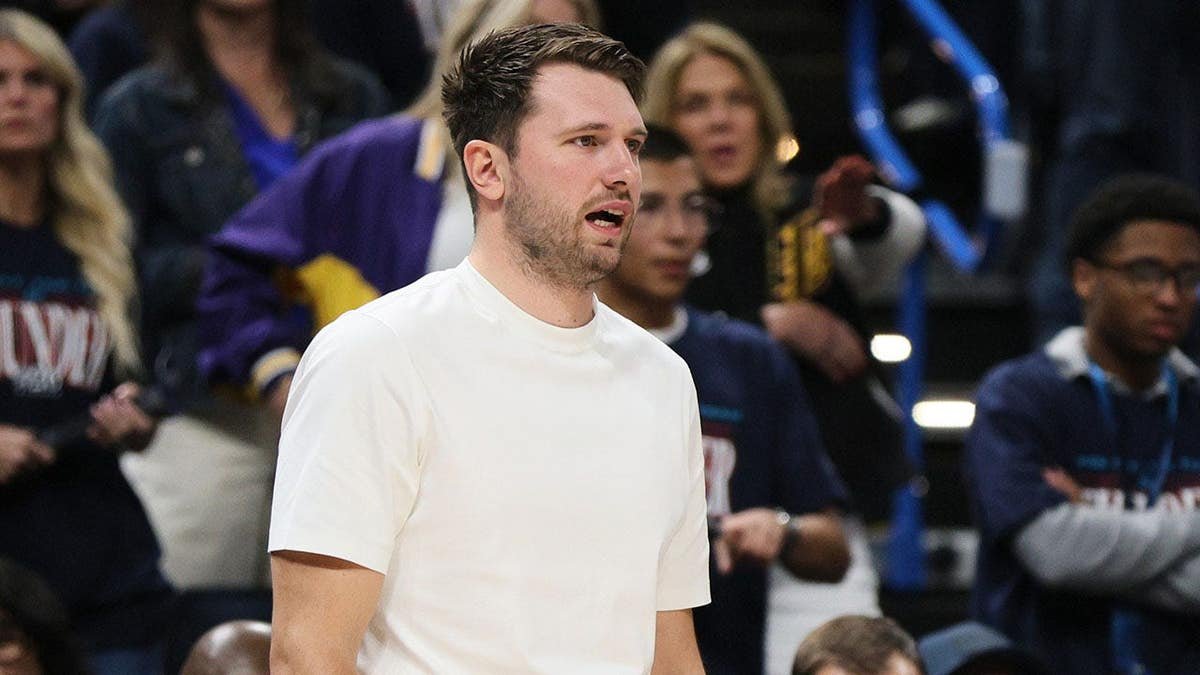 Luka Doncic of the Los Angeles Lakers watching play during a basketball game.