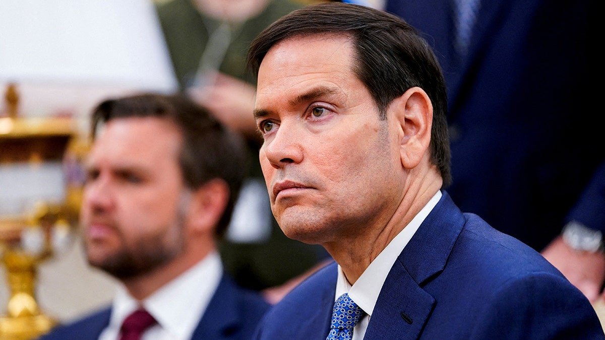 U.S. Secretary of State Marco Rubio listening during a meeting with President Donald Trump and NATO Secretary General Mark Rutte in the Oval Office