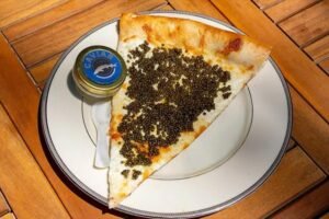 Philadelphia pizza shop sells slices topped with caviar, served on gold plate with keepsake spoon Philadelphia pizza shop sells slices topped with caviar, served on gold plate with keepsake spoon