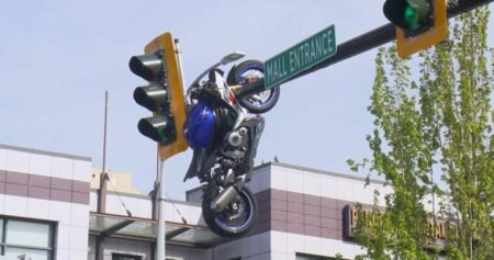Collision leaves motorcycle hanging from traffic light in Delta, B.C.