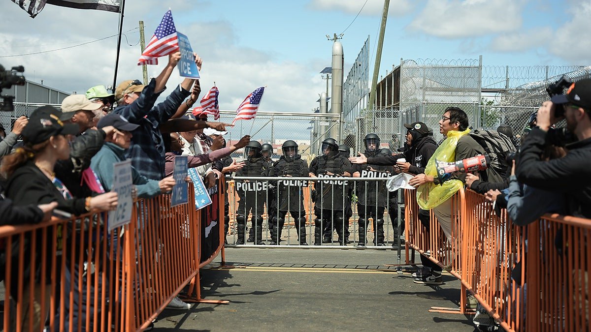 Demonstrators for and against the Delaney Hall detention center yell at each other outside the facility Saturday, May 30, 2026, in Newark, N.J. (AP Photo/Angelina Katsanis)