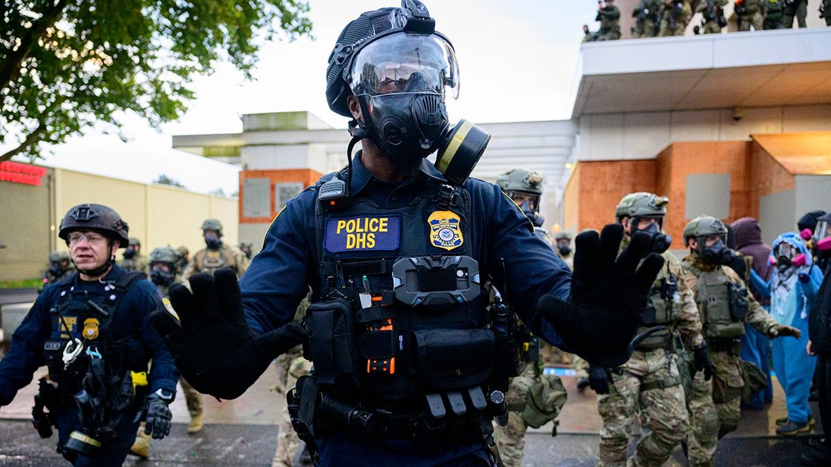 Federal agents clashing with anti-I.C.E. protesters outside U.S. Immigration and Customs Enforcement building in Portland