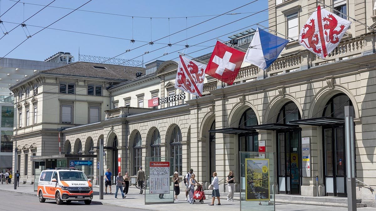 Police vehicle in front of train station in Switzerland
