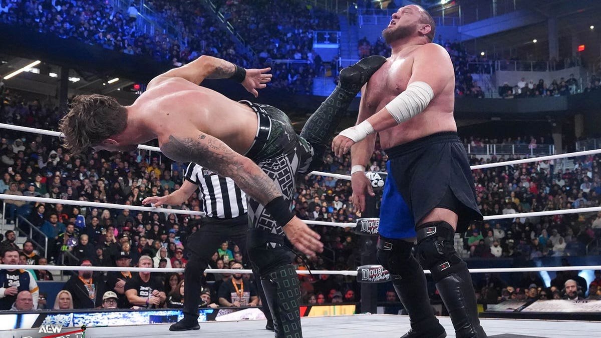 Samoa Joe and Will Ospreay wrestling in a ring in Queens, New York