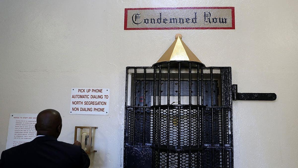 Lt. Sam Robinson calls to open a door at San Quentin State Prison death row