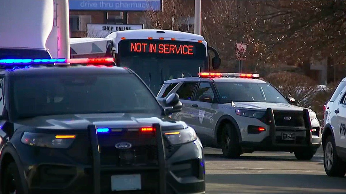 Police officers standing on a road near an ICE arena in Pawtucket, Rhode Island