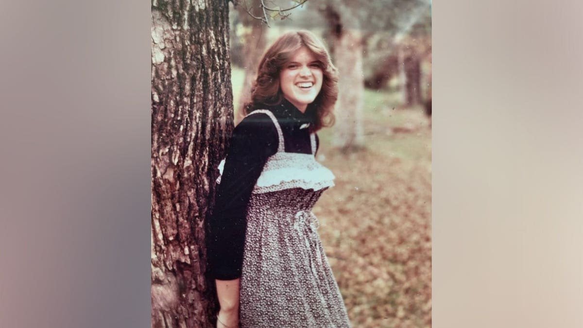Susan Vesey standing in front of a house in Everett Washington