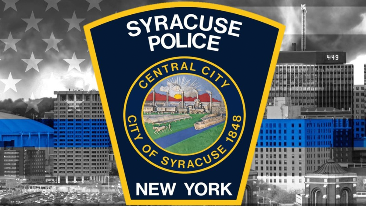 Syracuse Police officers standing together outdoors