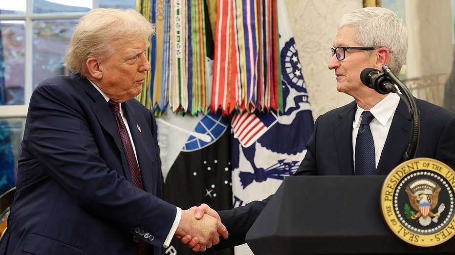 President Trump shakes hands with Apple CEO Tim Cook