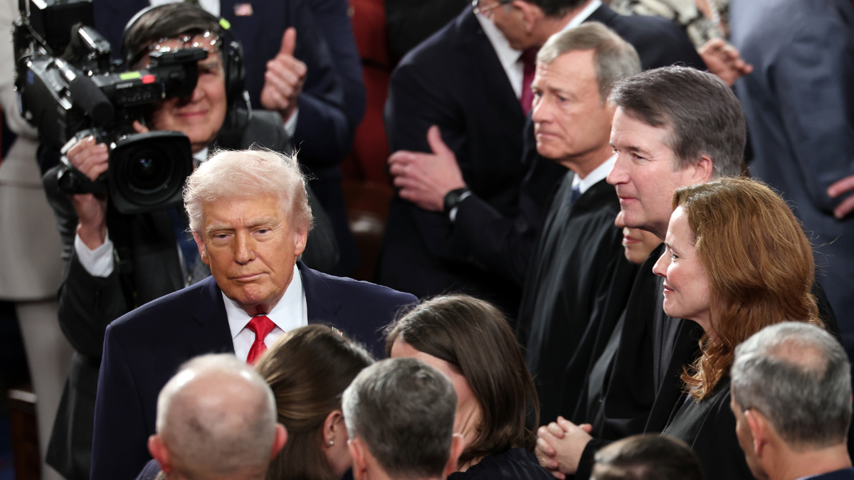 President Donald Trump walking past Supreme Court Chief Justice John Roberts and Associate Justices Elena Kagan, Brent Kavanaugh, and Amy Coney Barrett at U.S. Capitol