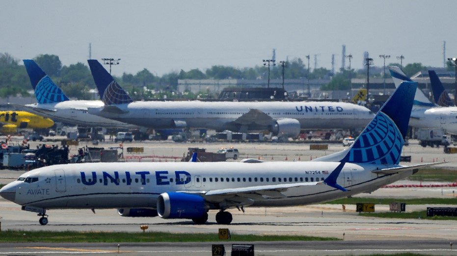 United Airlines plane taxis on the tarmac