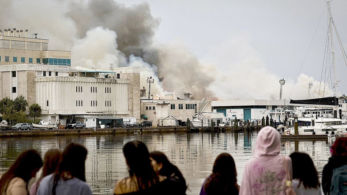 Firefighters extinguishing fire on University of South Florida campus in St. Petersburg