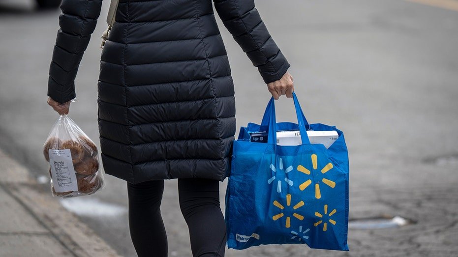 Shopper carries Walmart bag