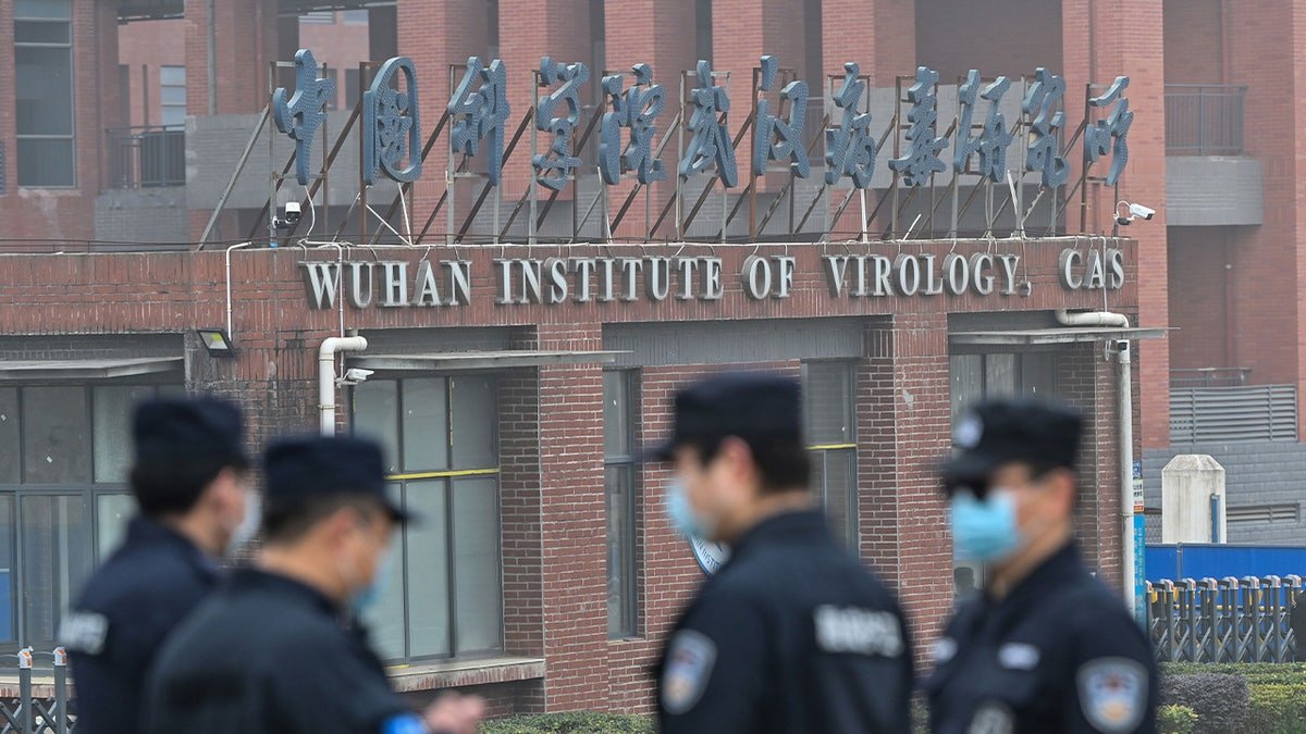 Security personnel standing guard outside Wuhan Institute of Virology in Wuhan