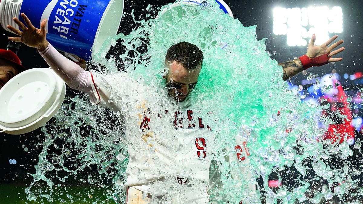 Los Angeles Angels' Zach Neto celebrating after hitting a walkoff home run.