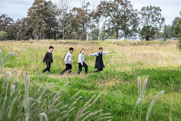 Skylar Christian and friends Mia Georgievski, Shravan Sairuban and Hamilton Huang at the site of the future schools in Bella Vista. 