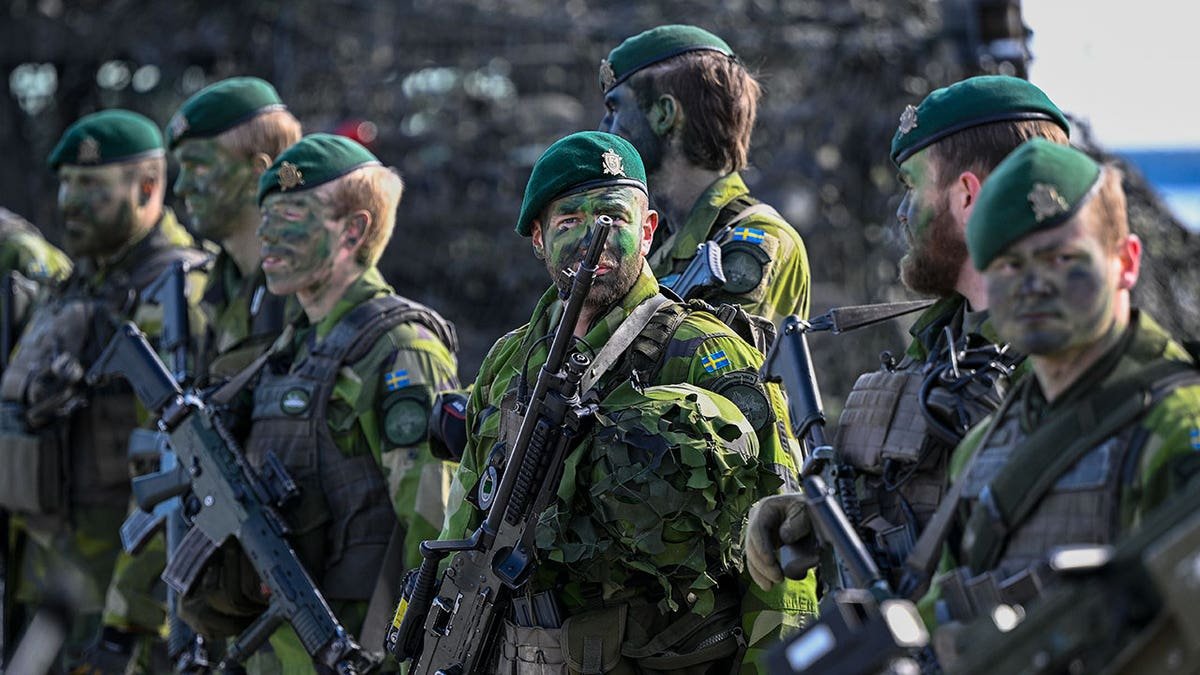 Swedish soldiers standing in formation at Berga naval base during military exercise Aurora 23