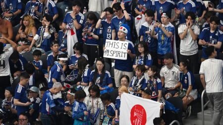 Japanese World Cup fans clean up stadium with NFL quarterback after team draws with the Netherlands
