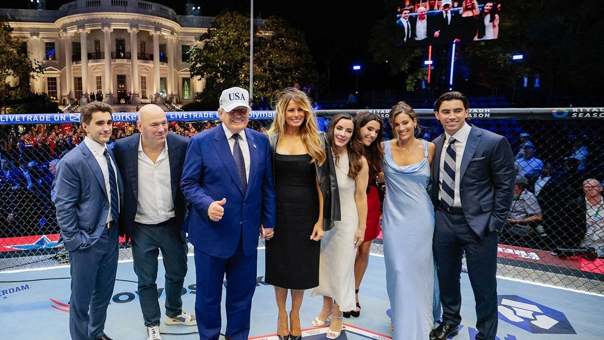 US President Donald Trump and First Lady Melania Trump stand in the Octagon with UFC president Dana White and guests on the White House South Lawn