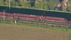 Two-train crash leaves 1 dead, 89 injured as emergency crews rush to chaotic scene