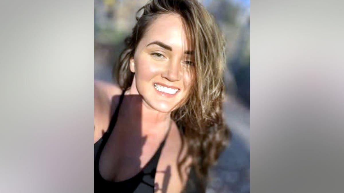 Elena Katherine Moore smiling in a photo
