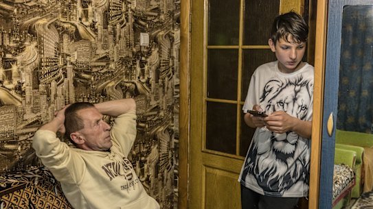 Anatolii Prokhorenko and his father Volodymyr Poltoratskyi in their relatives’ apartment in the regional capital, two hours south of their village.