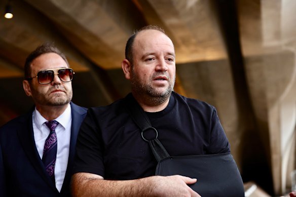 Ahmed al Ahmed (centre) arrives at the Opera House for The Australian National Day of Mourning on January 22.