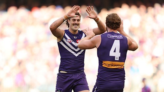 Luke Jackson of the Dockers celebrates a goal during the round 16 AFL match between Fremantle Dockers and Gold Coast Suns at Optus Stadium.