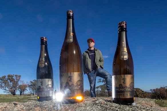Matt Froude at Elgo Winery near Seymour where he makes wine. He is pictured with bottles of his Municipal sake, which he makes in Japan.