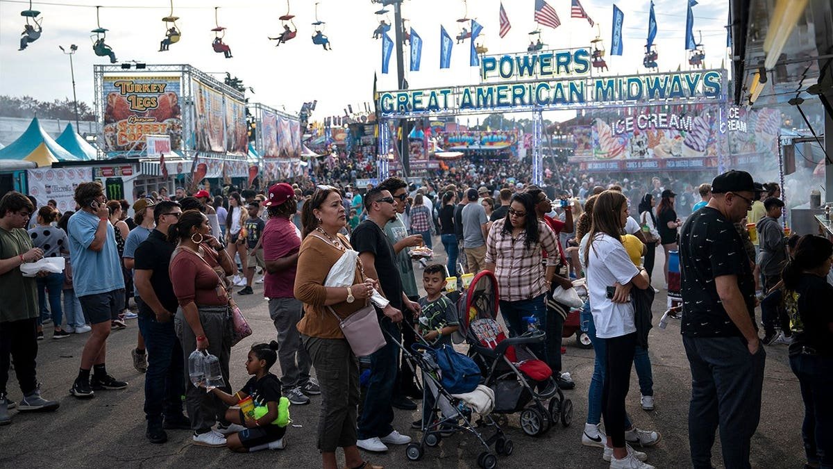 People standing outside food stalls at North Carolina State Fair