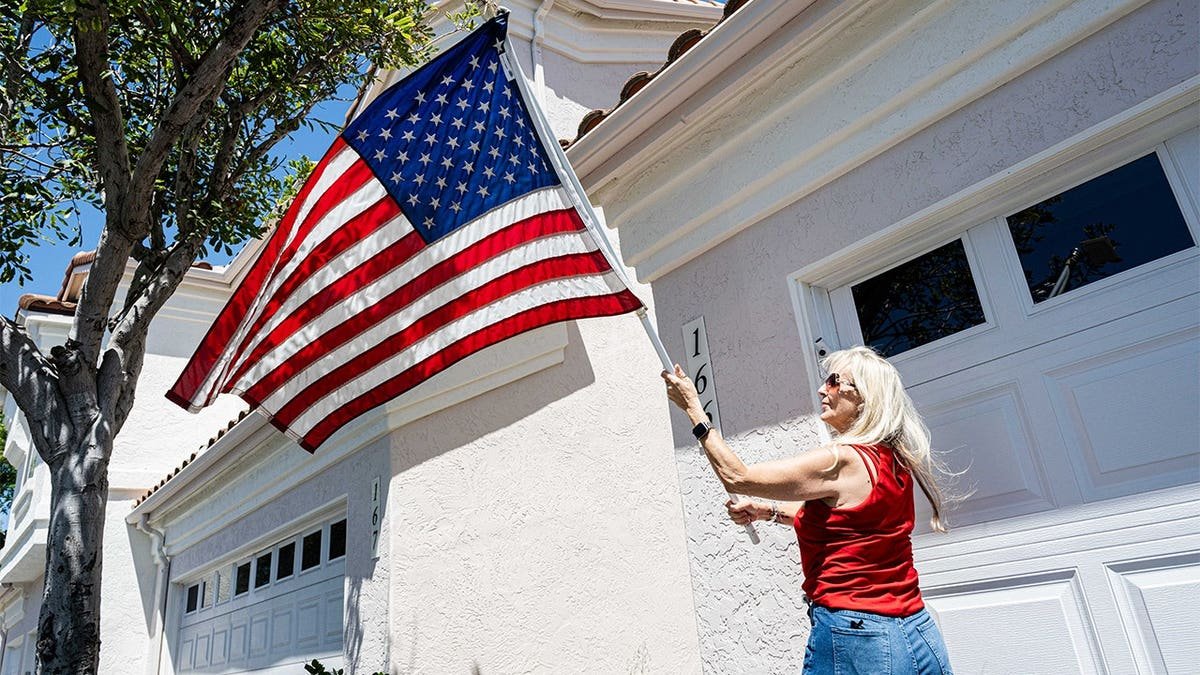 Amy Cooke holds American flag