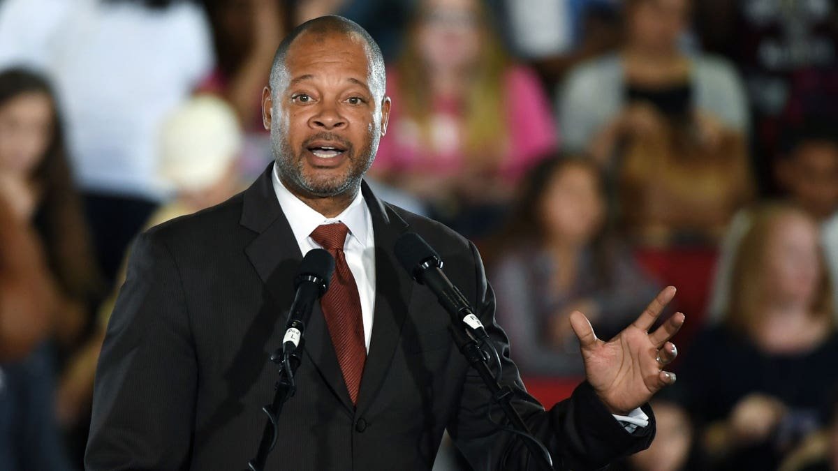 Aaron D. Ford speaking at a get-out-the-vote rally with Barack Obama at Cox Pavilion in Las Vegas