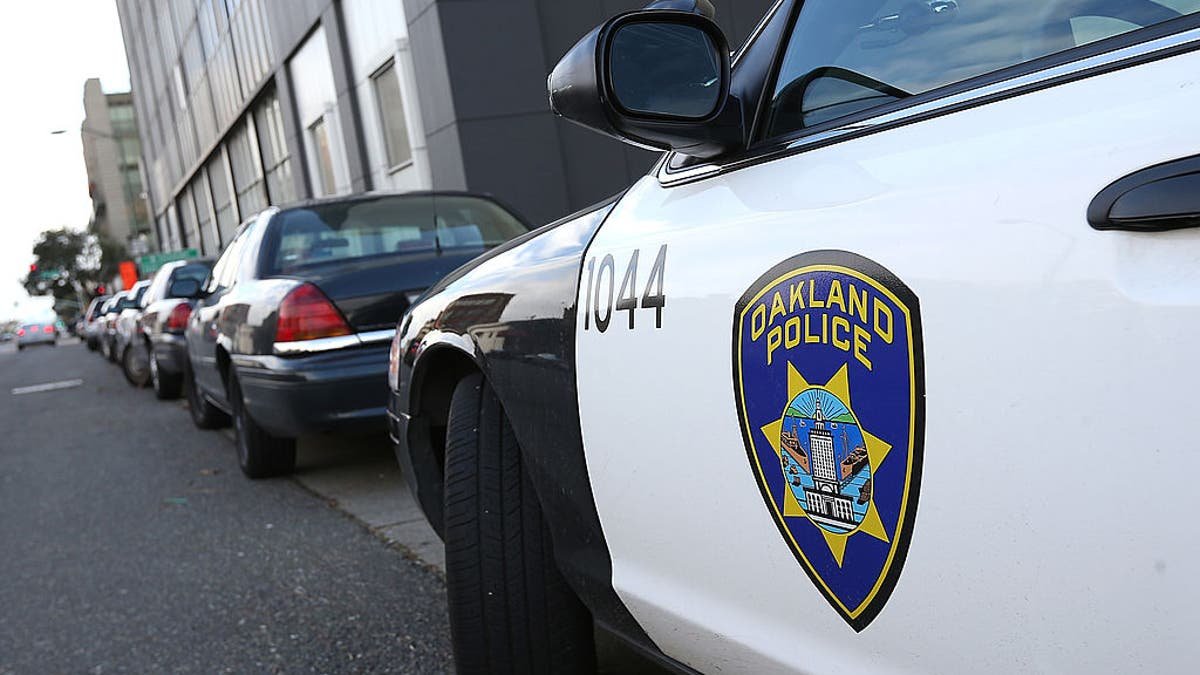 An Oakland Police patrol car parked outside Oakland Police headquarters.