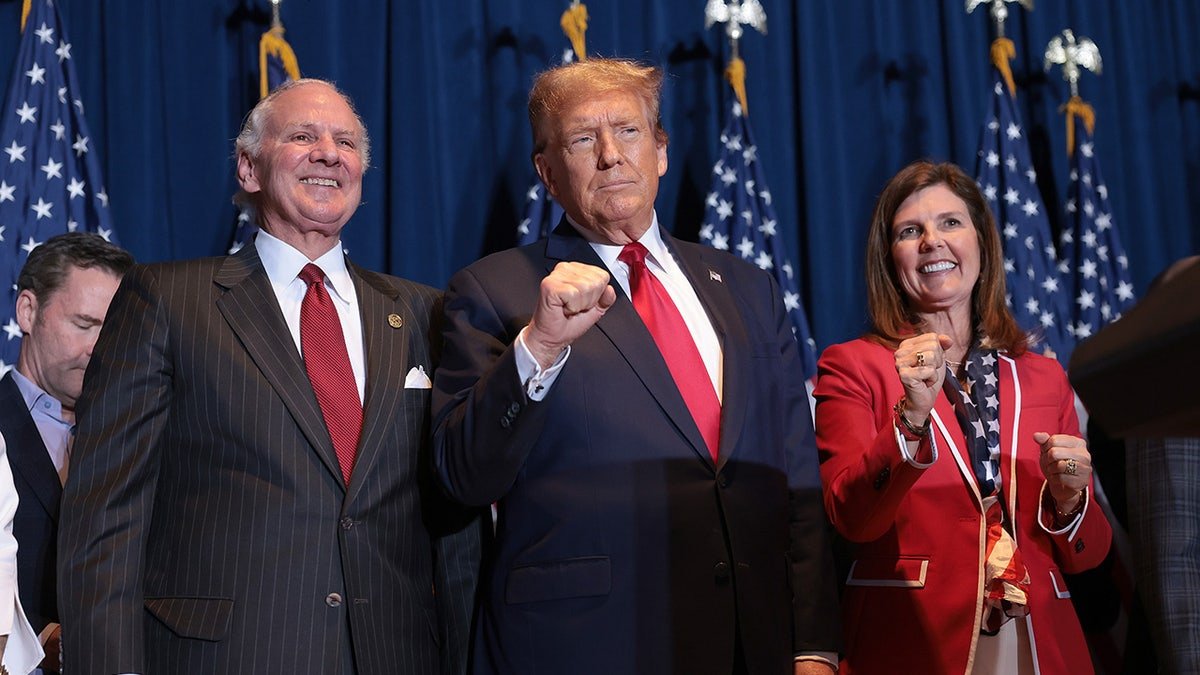 South Carolina Gov. Henry McMaster, Donald Trump, and Lt. Gov. Pamela Evette standing on stage in Columbia