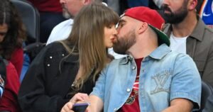 Travis Kelce Honors Taylor Swift With ‘Pretty Man’ Movie Poster at ‘New Heights’ Live Show in L.A.