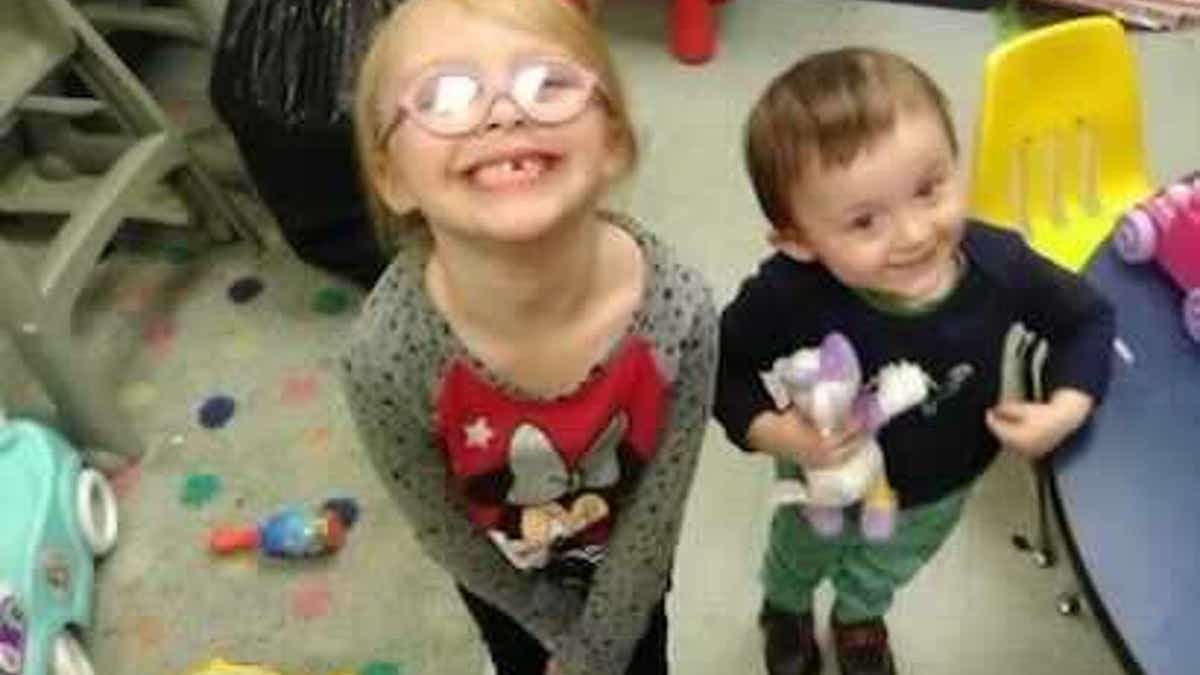 Harmony Montgomery and her little brother Jamison standing together at a foster home.