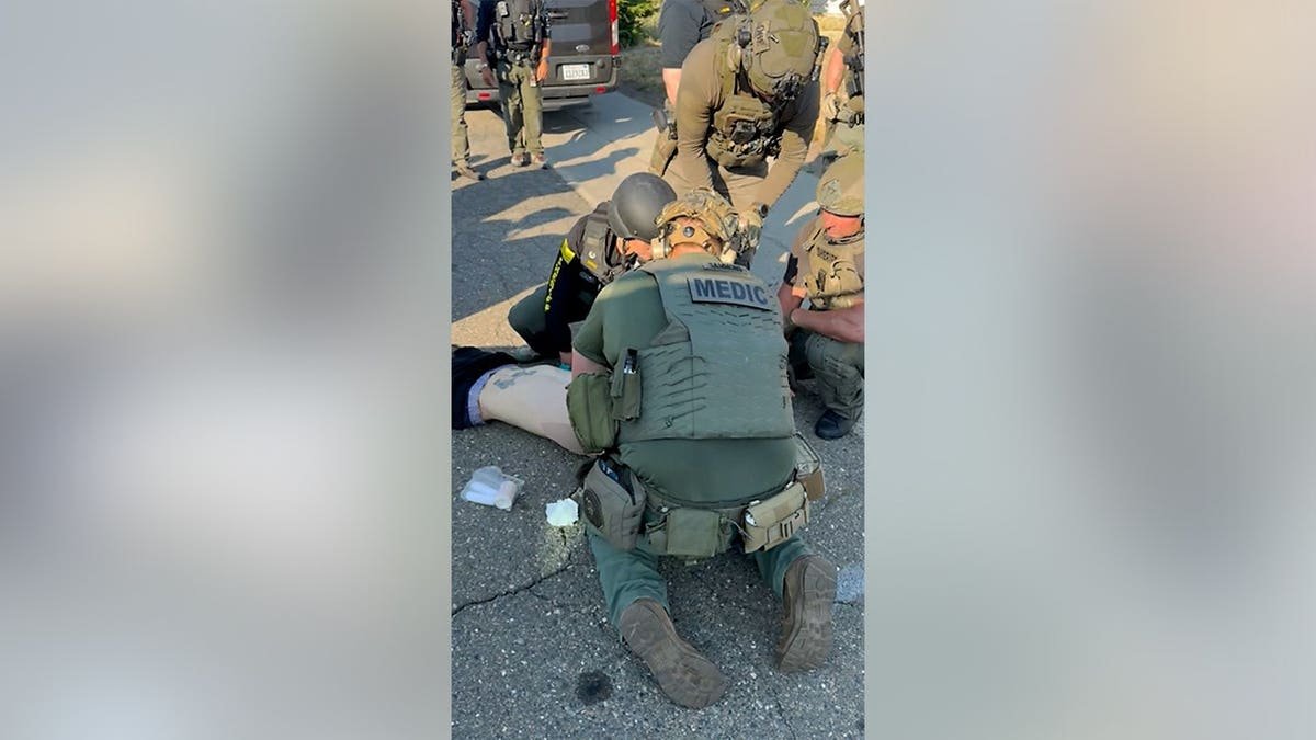 Deputies render aid to Austin Carter after he was apprehended