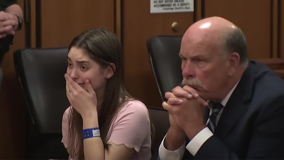 Mackenzie Shirilla crying and covering her mouth in a courtroom