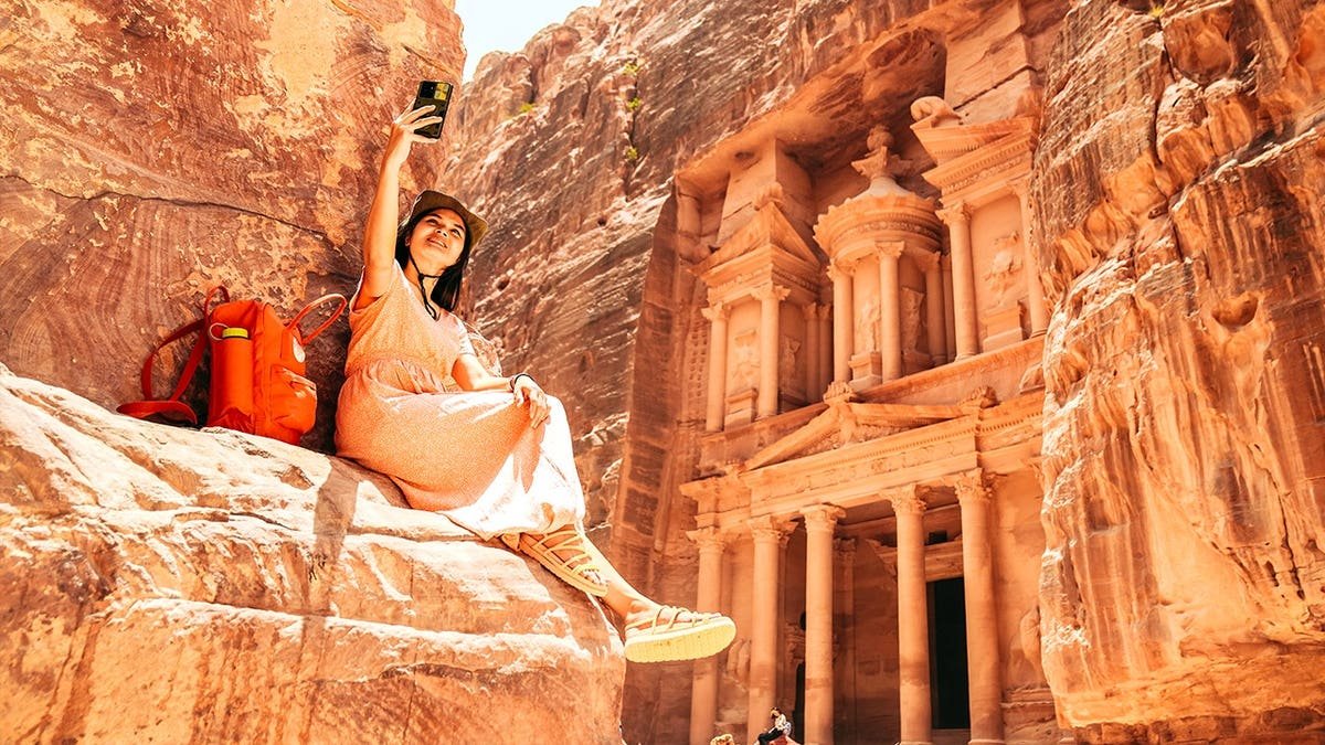 Woman taking selfie in Petra, Jordan