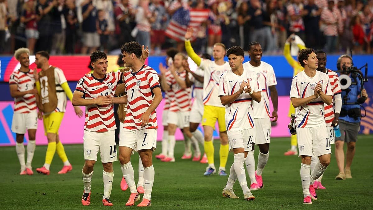 U.S. men's national team players celebrate after a soccer match