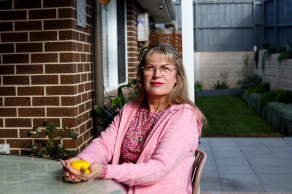  Jenny Greer holds the new medical device which helps her manage a bowel disorder. 