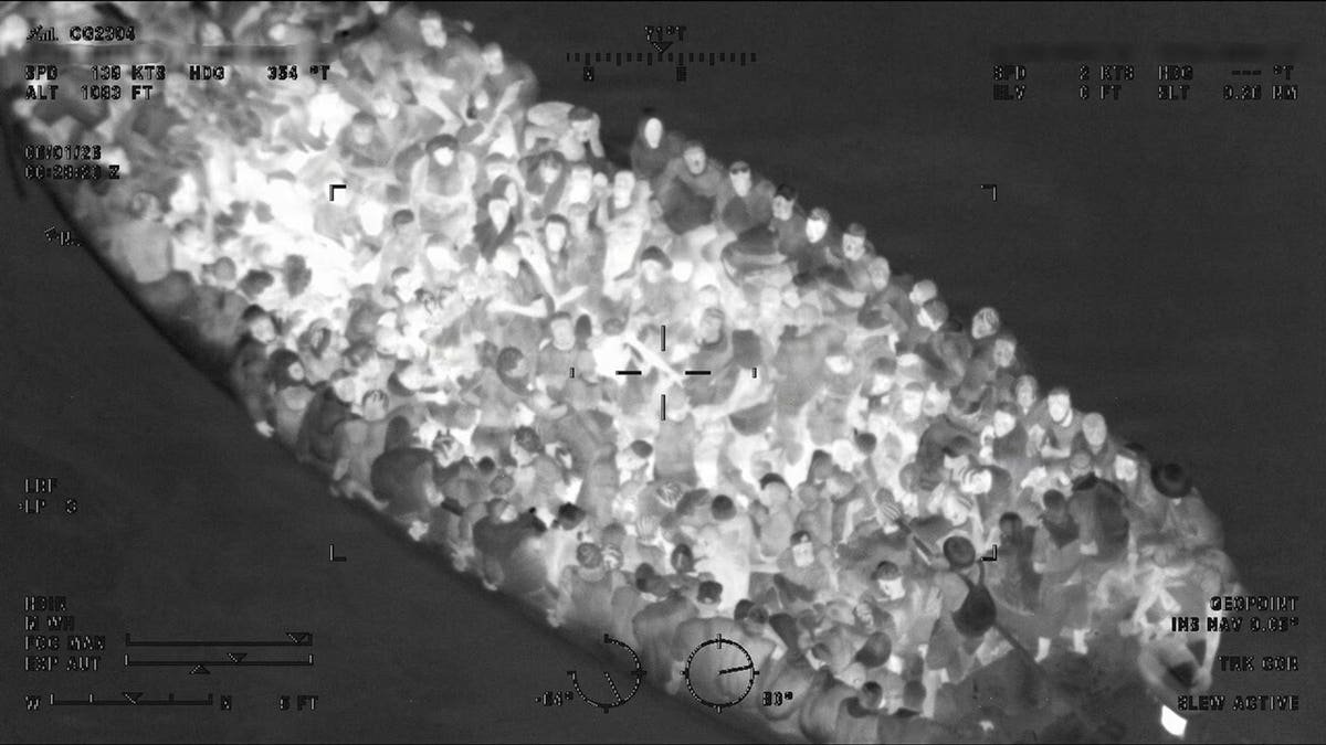 A Coast Guard aircrew helped guide responding vessels to an overcrowded migrant boat carrying hundreds of people, officials said.