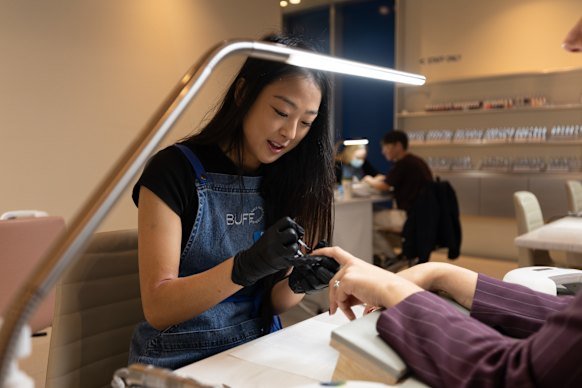 Grace Yoo, salon manager at Buff Nails in Fitzroy, at work.