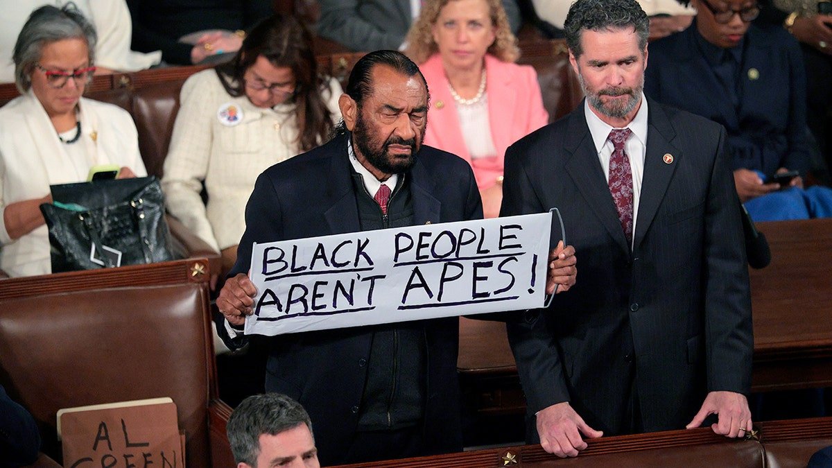 Rep. Al Green holding a sign during State of the Union address at U.S. Capitol in Washington, D.C.